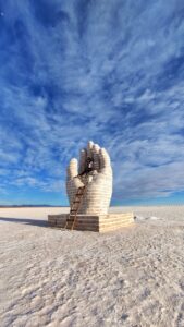 A Woman Sitting on Concrete Sculpture